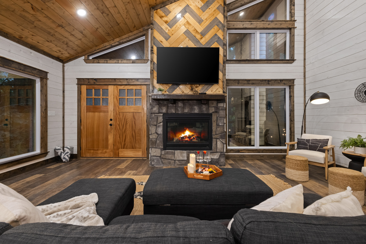 Come inside and get cozy around the fireplace. The open living space keeps everyone together after a day of exploring.