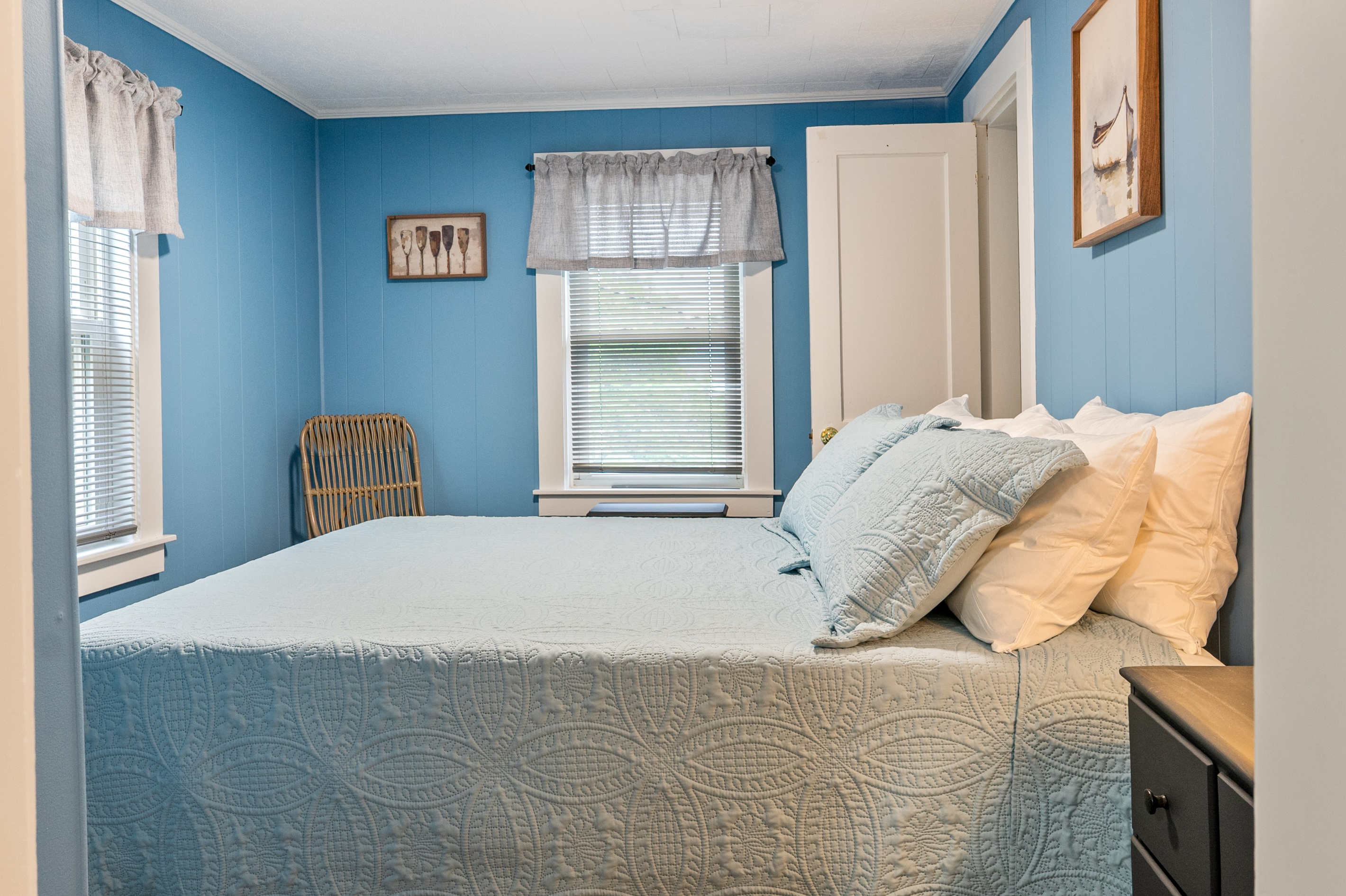 Step through the doorway from The Pebble Nook and feel the relaxed energy of this private room. Anchored by a supportive queen memory foam mattress and layered blankets, it offers a peaceful spot to fully recharge after exploring Maine.