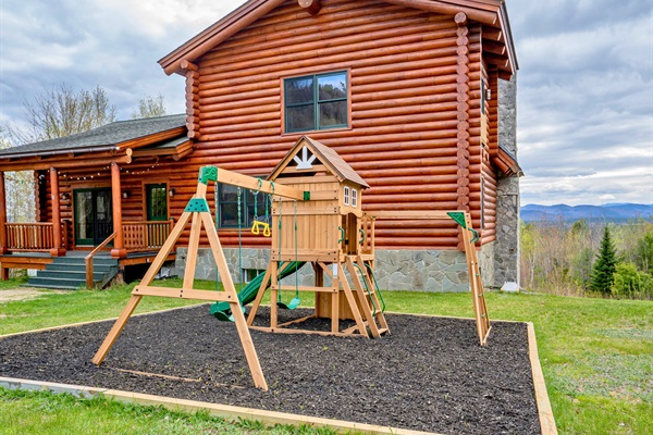 Take in the peaceful woodland setting while the kids enjoy the playground just steps away from the cabin