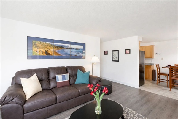 Living Room: Bright and airy retreat with comfy seating, vibrant decor, and a welcoming ambiance!