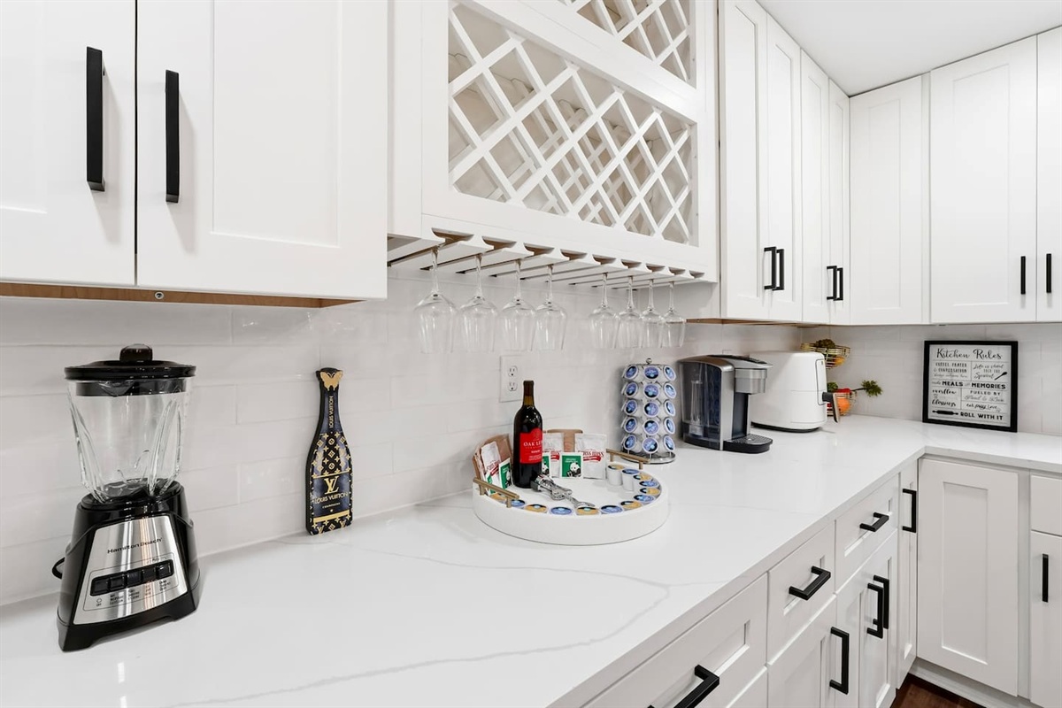 Beautiful white kitchen fully equipped with all the appliances and essentials of a home away from home.