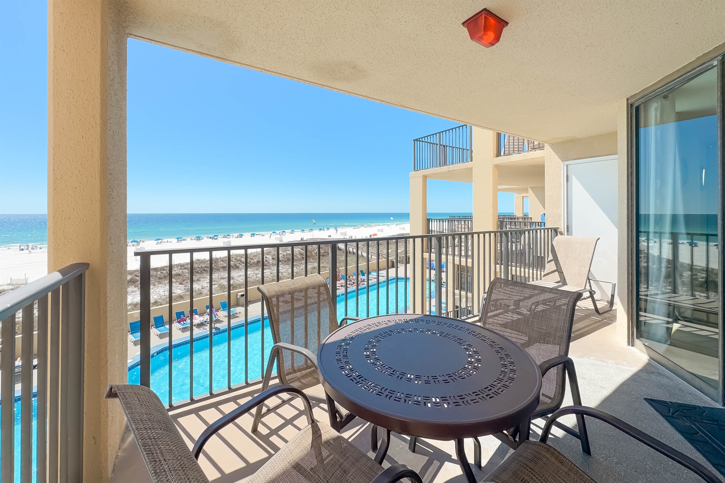 Step out onto your private oasis. This spacious balcony offers ample room for dining and lounging, delivering a quintessential coastal experience.