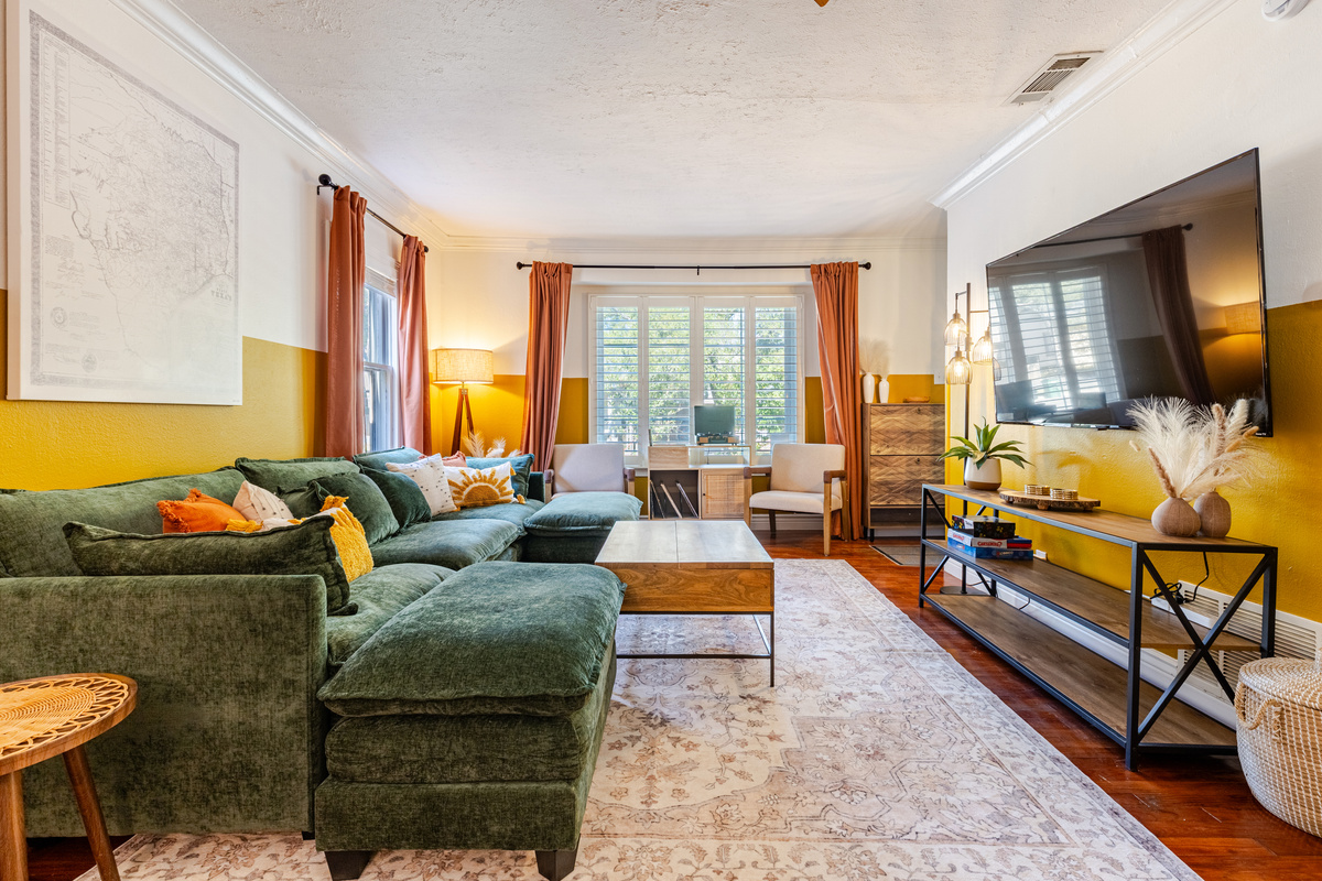 Vibrant decor & comfy greenery invite relaxation and fun gatherings!