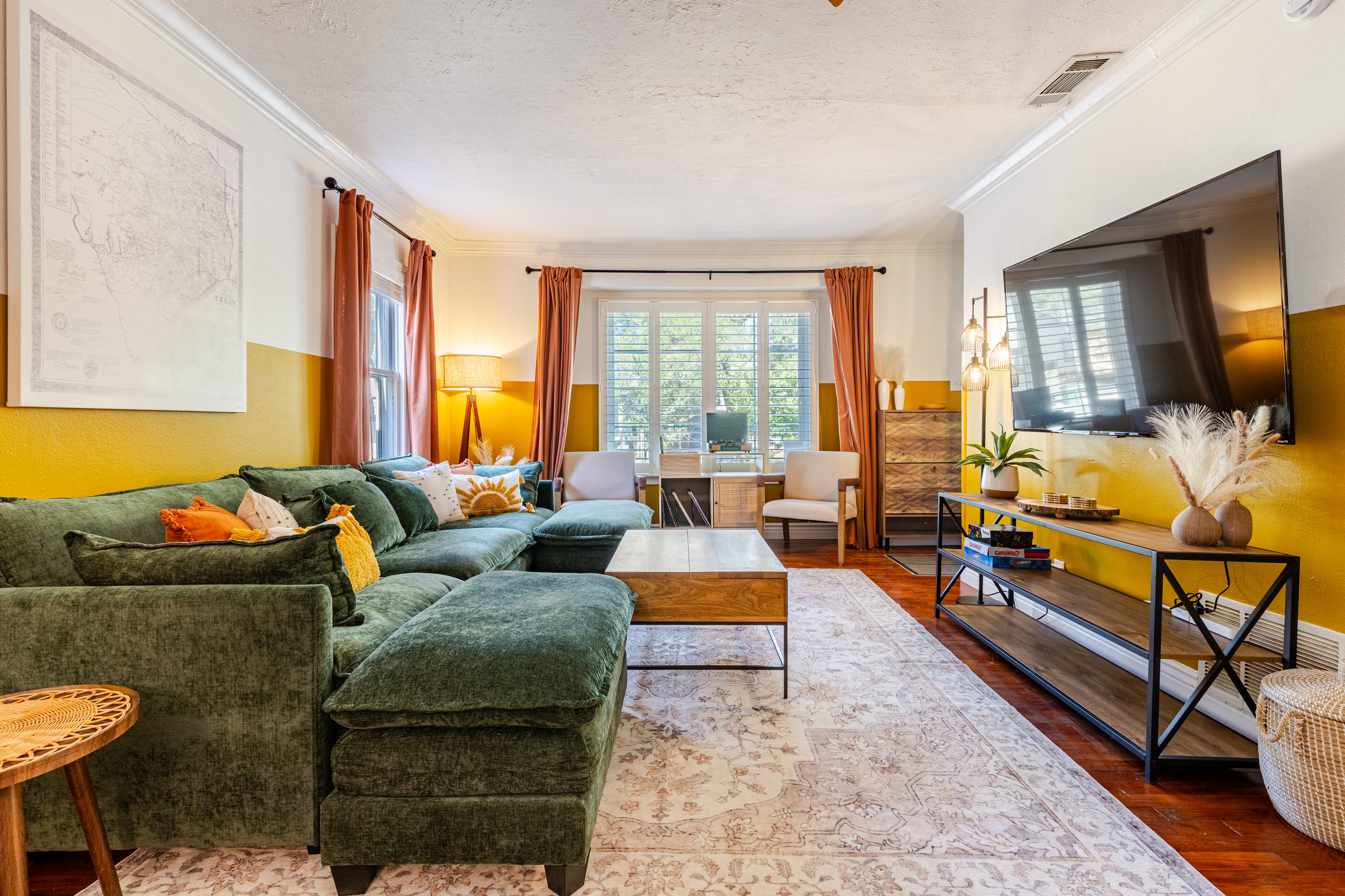Vibrant decor & comfy greenery invite relaxation and fun gatherings!