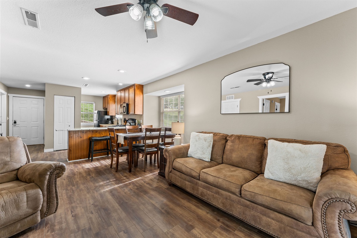 Kick back in your cozy, open-concept living space—perfect for unwinding after a day of adventure and making memories together