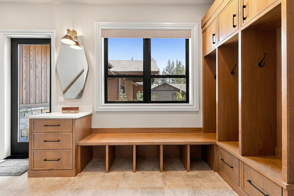 Spacious mudroom with built-in benches, hooks and storage for ski gear, boots and outdoor essentials