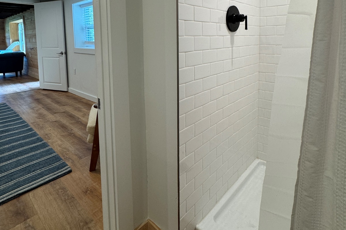 En-suite bath with shower