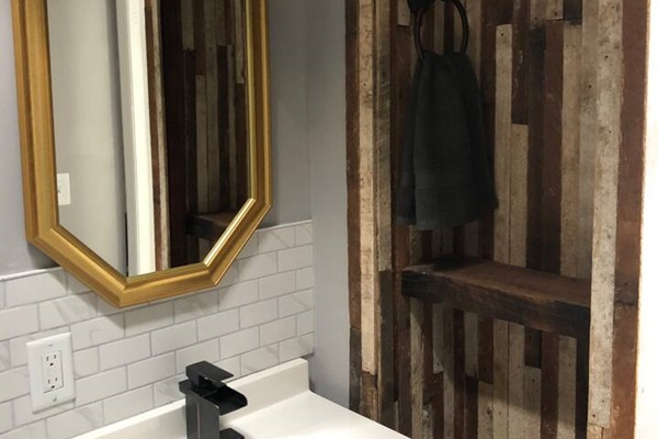 Reclaimed lath paneling used for bathroom shelving