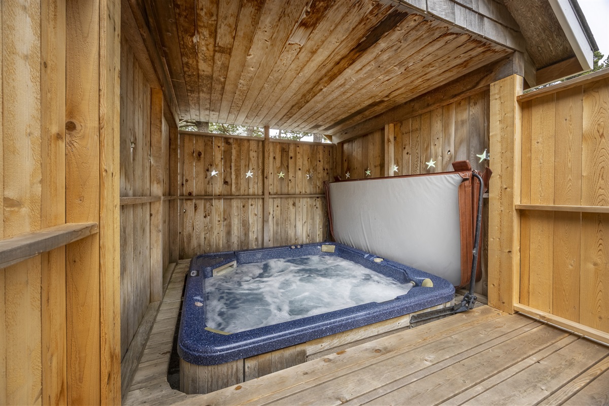 Enjoy a large hot tub that comfortably fits 6–8 guests ~ perfect for relaxing after a day at the beach!