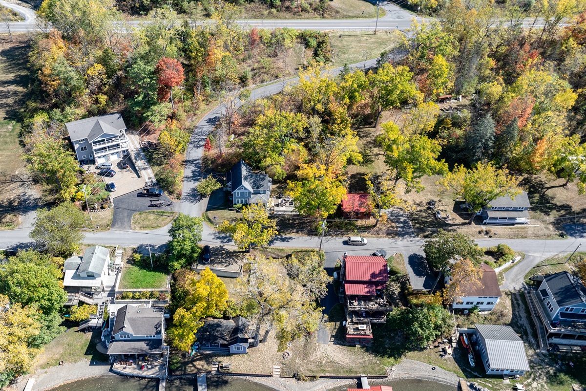 Nestled among colorful fall trees, this peaceful lake community offers the perfect mix of nature and charm