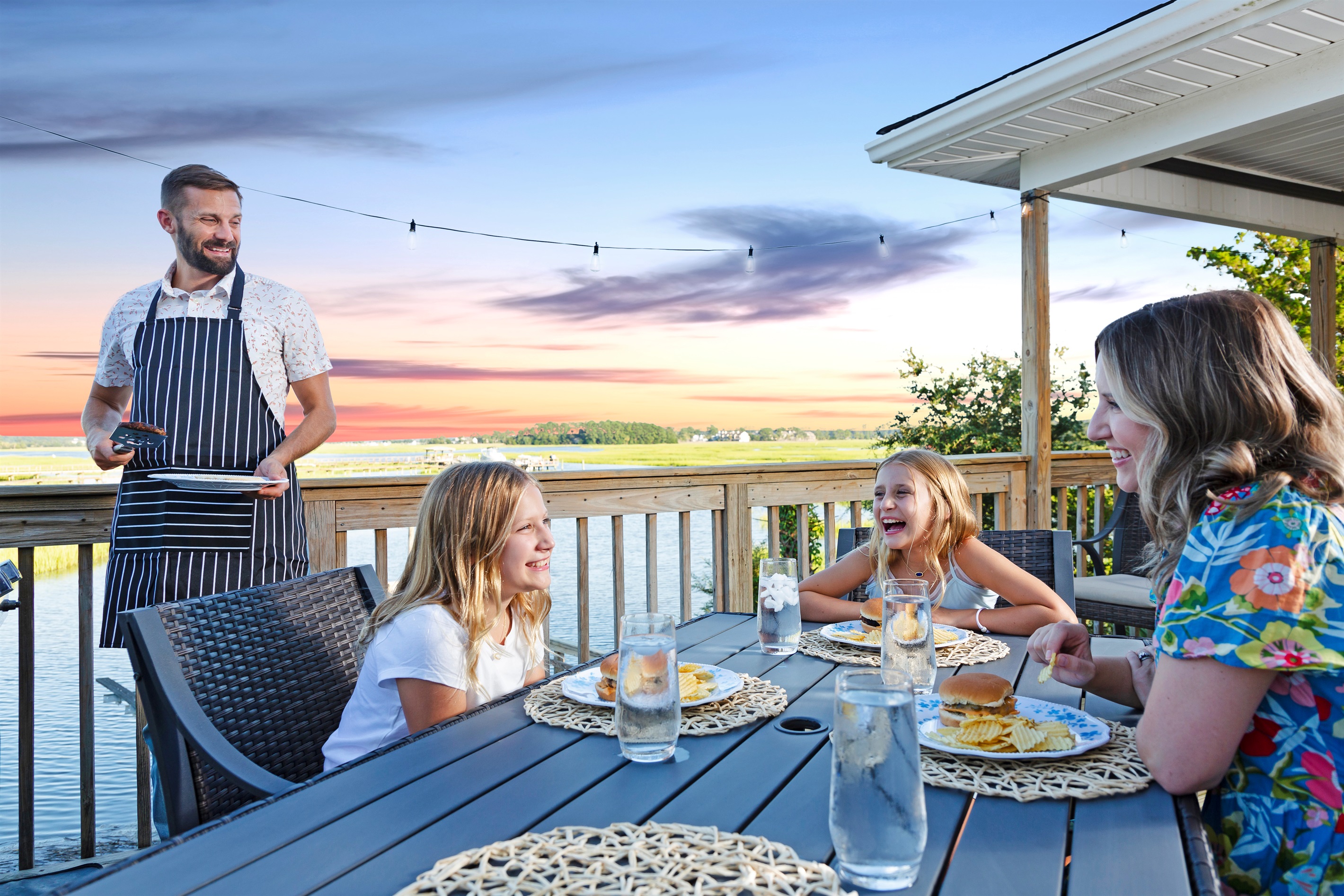 Fire up the grill and gather for family meals outdoors by the river.