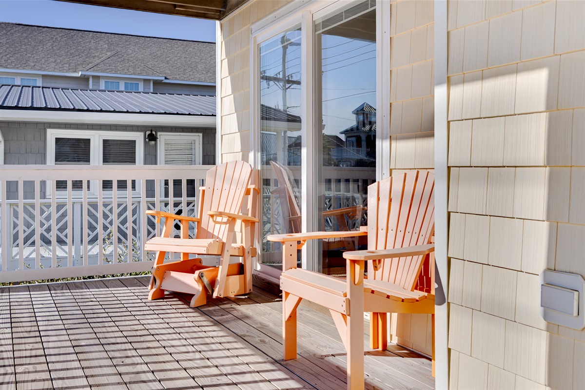 Sunny balcony seating just outside the bedroom