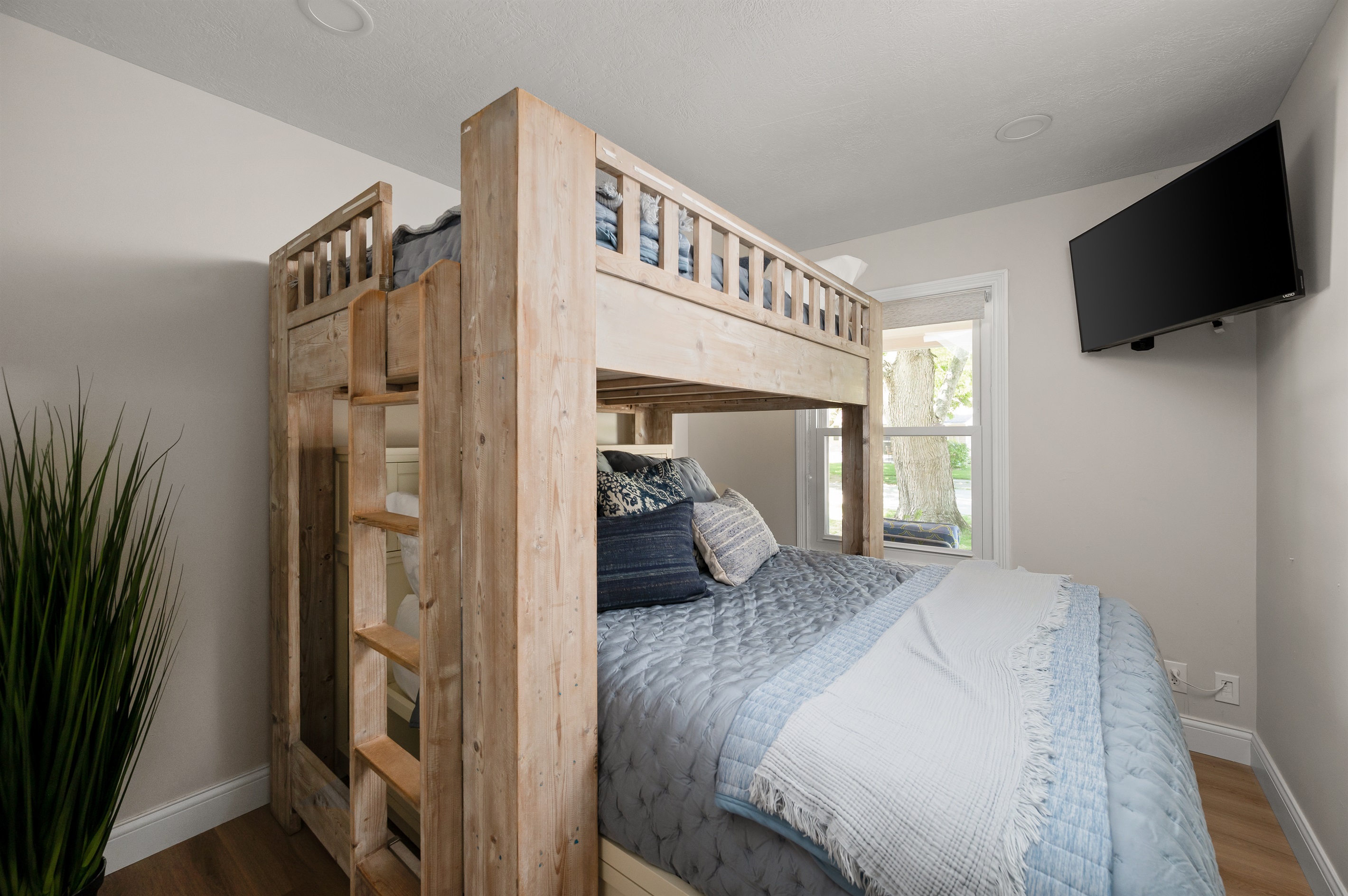 Bedroom #3 features a spacious full over queen bunk bed setup, perfect for kids, friends, or extra guests traveling together.