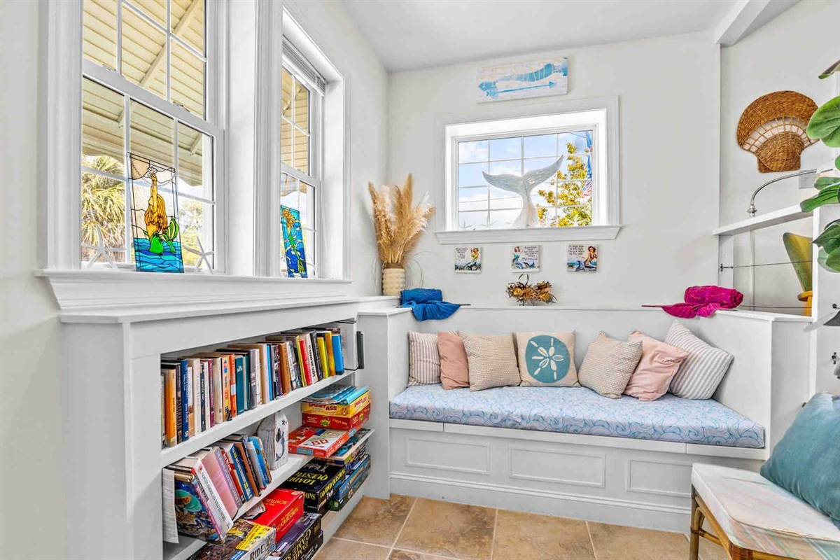 A stocked reading and gaming nook for rainy days!