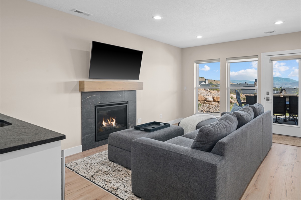 Downstairs Living area with a kitchenette with access to patio and hot tub