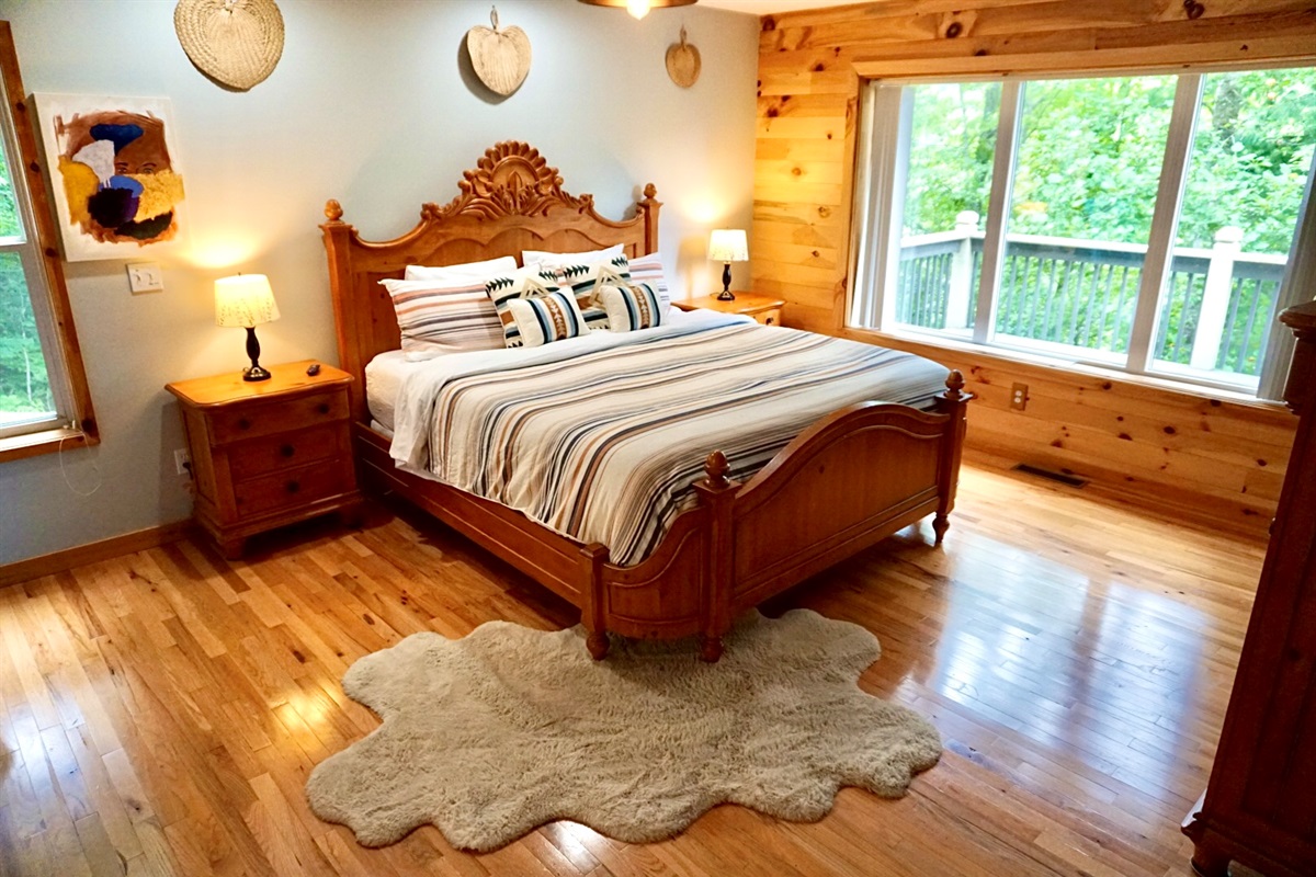 Elegant wooden furnishings and views of lush greenery await your relaxation!