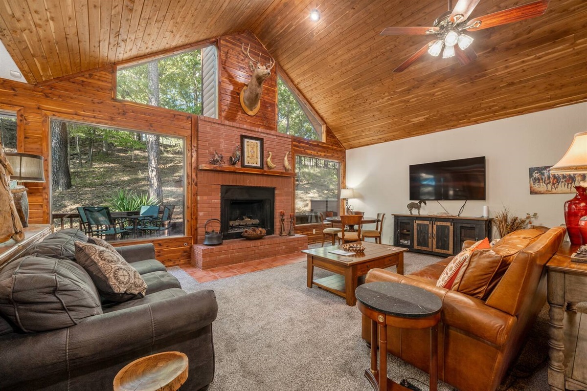 The large spacious living room will live up to your entertaining needs. Relaxing sofas, wildlife, games and puzzles, a smart tv. You won't need the tv. -Photo from dining area - Living room