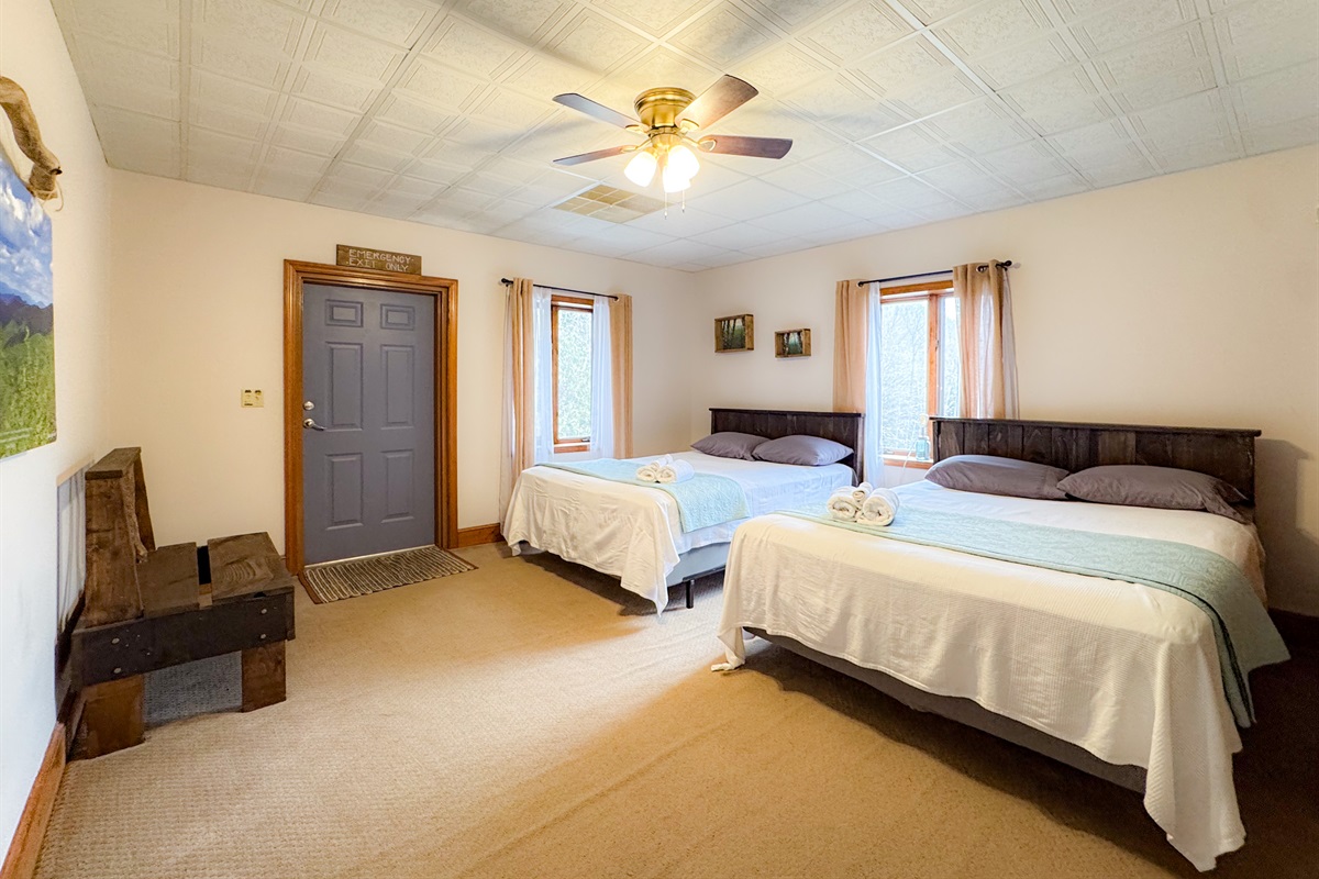 The mountain views bedroom features two queen beds