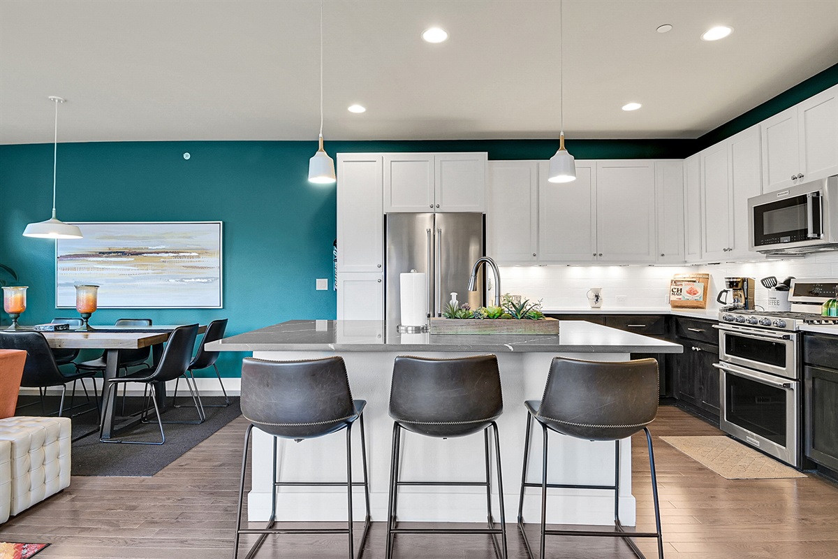 Large kitchen with working area and seating at the island