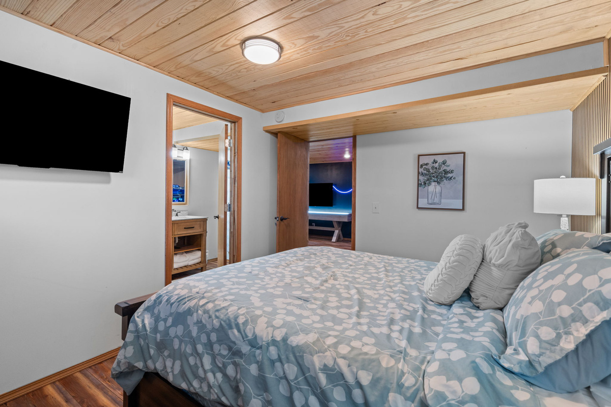 Queen Bed off Game Room