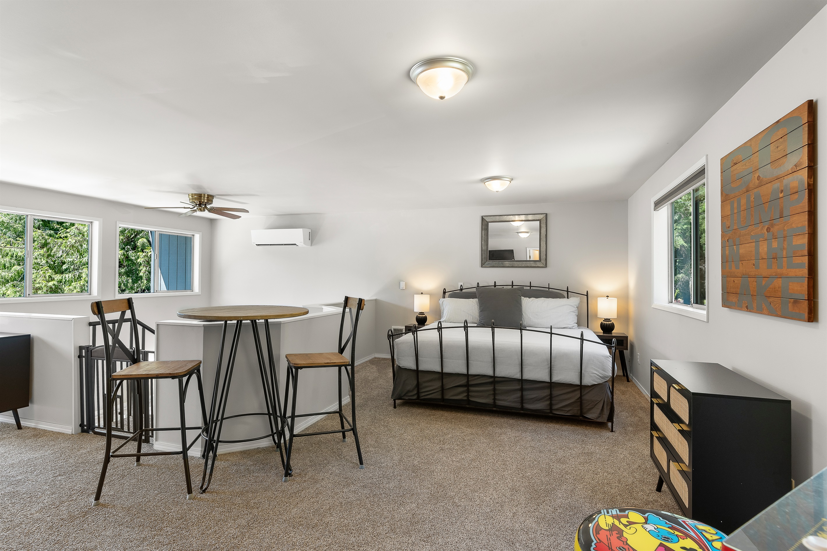 Upper-level king bedroom and seating area.