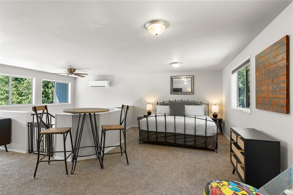 Upper-level king bedroom and seating area.