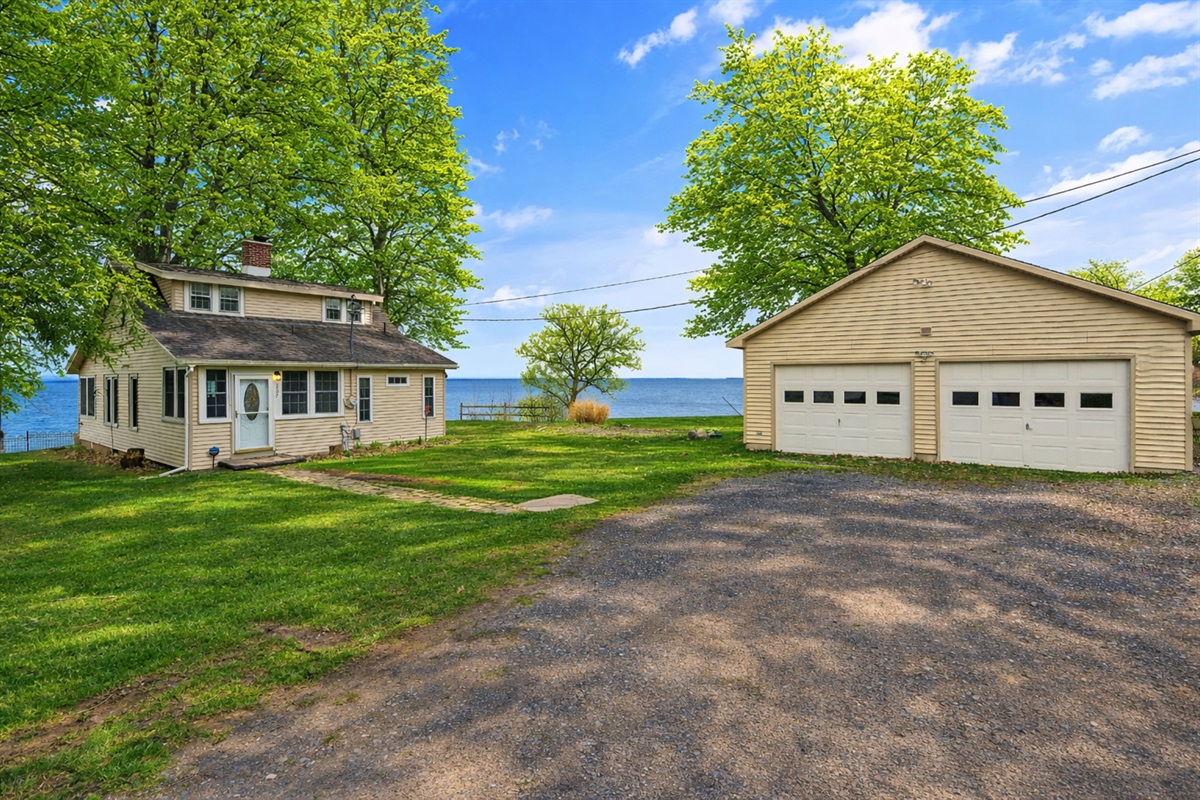 Ample parking space and a detached garage just steps from the water’s edge.