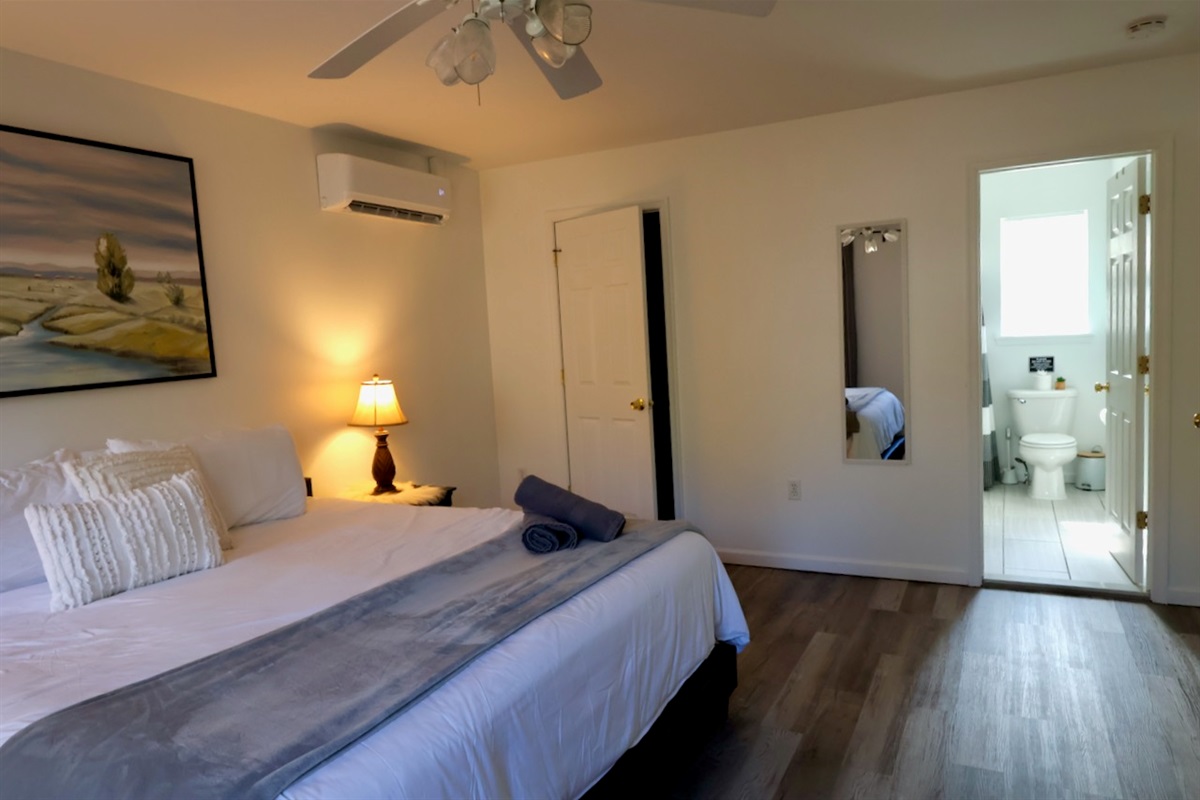 with a peak into the attached bathroom