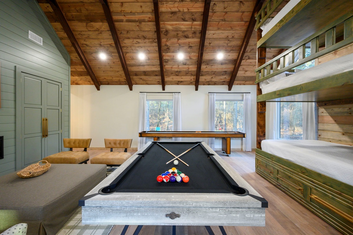 7' Full-size pool table under soaring ceilings &mdash; game on!