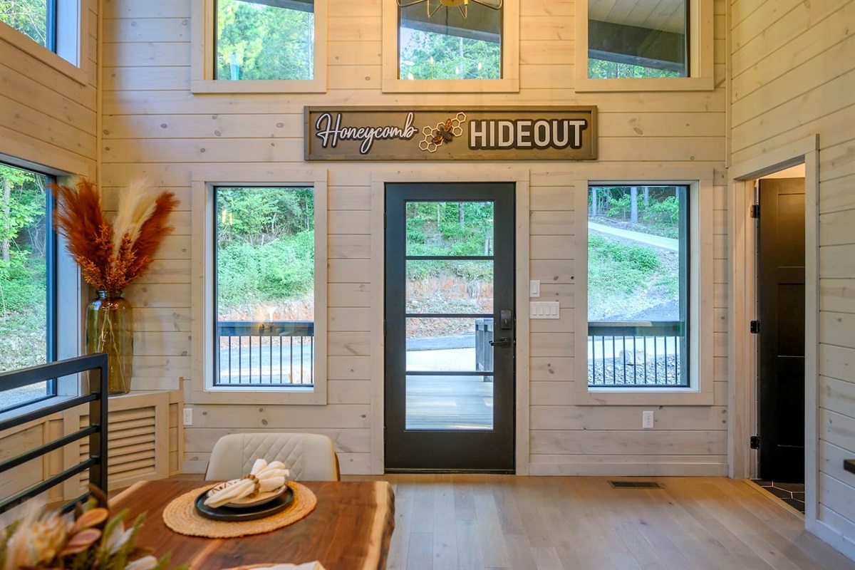 A view from the dining room to the front entrance.  Check out our new Honeycomb Hideout sign!