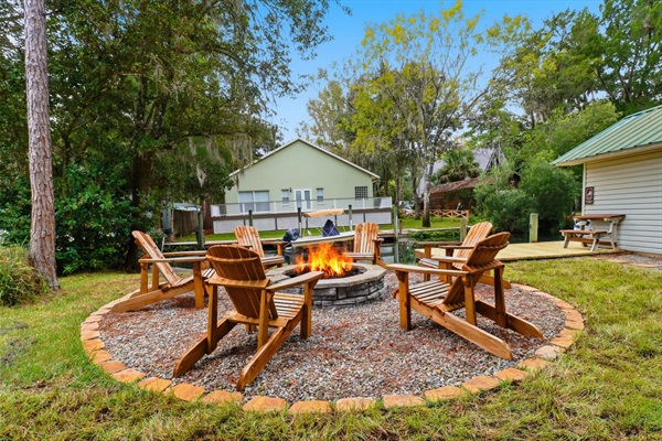 Massive waterfront fire pit with firewood supplied & 6 adirondack chairs.