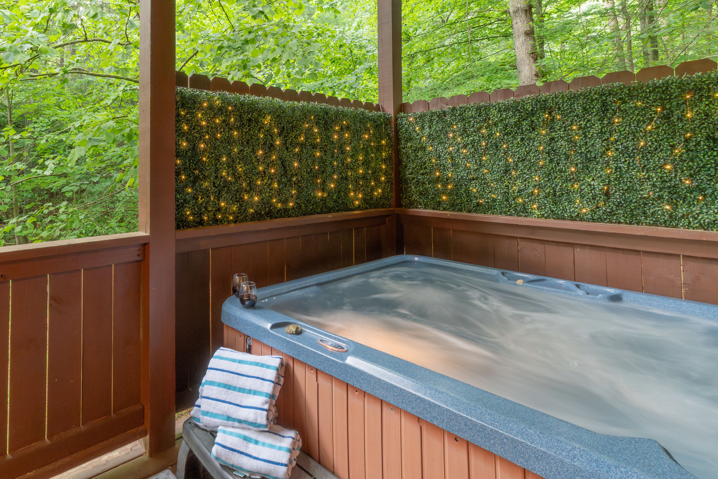 Soak in the private hot tub surrounded by peaceful Smoky Mountain woods.