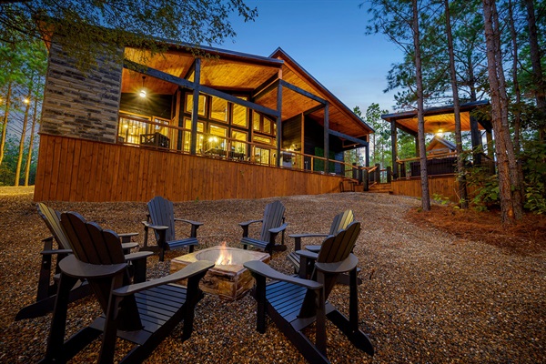 Modern luxury under the pines. Unwind by the fire at this peaceful retreat.