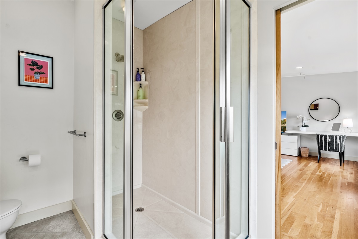 Modern ensuite featuring a spacious walk-in shower.
