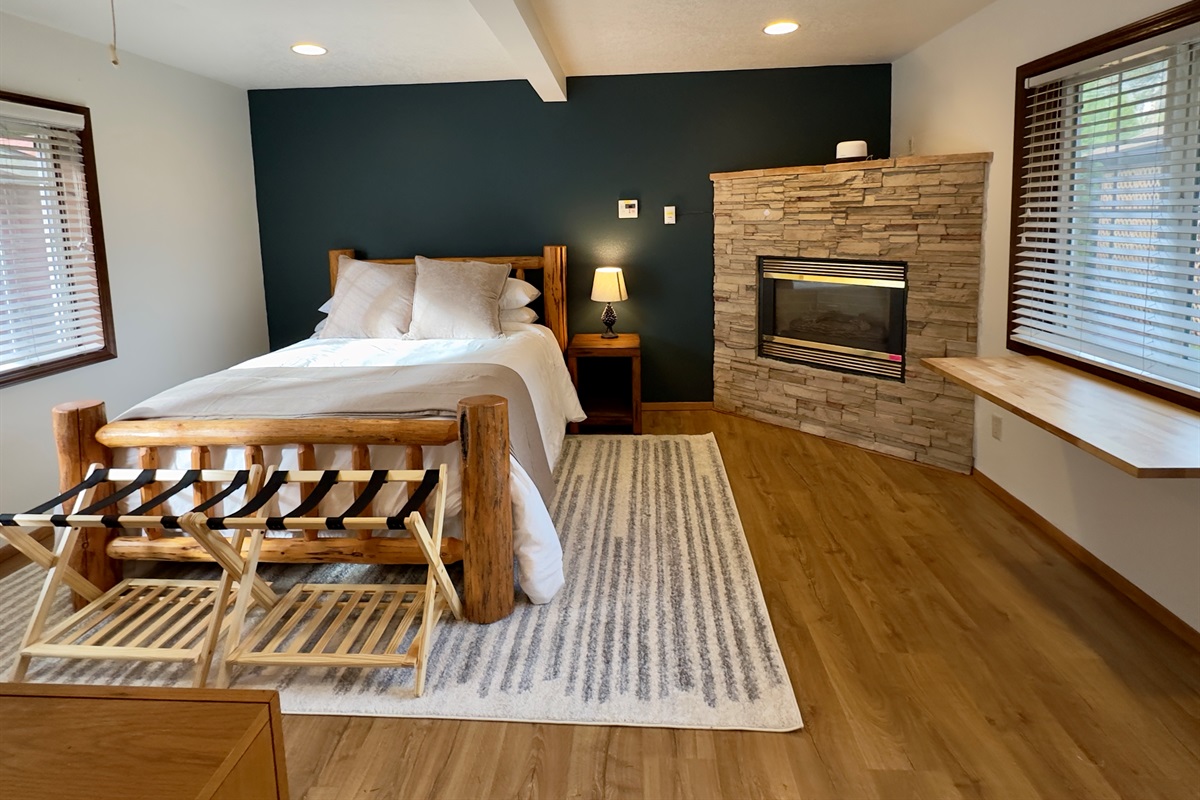 The barn offers a cozy log-framed queen bed, large windows and fireplace