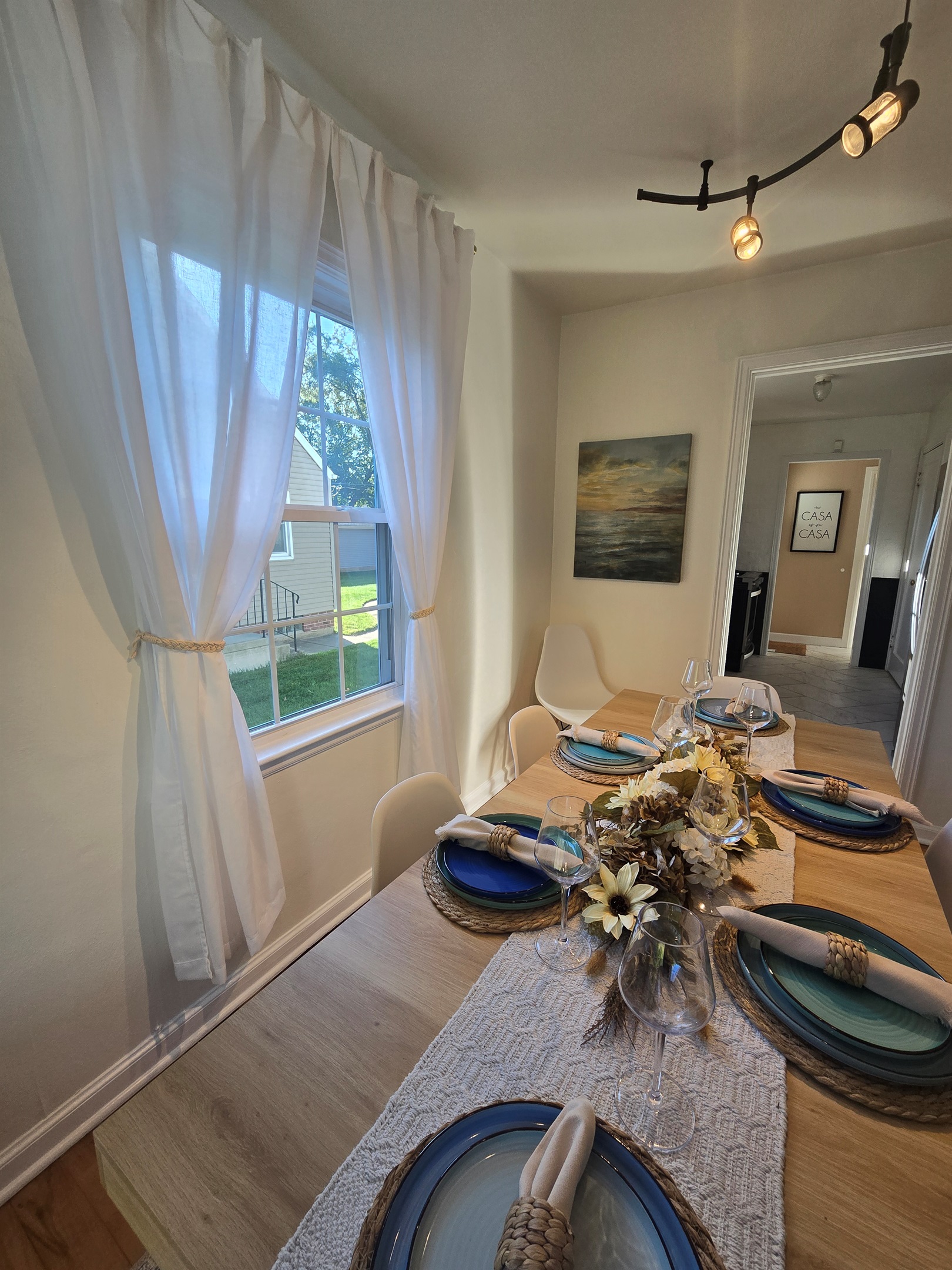 Hardwood charm and a table set to impress—perfect for intimate dinners or lively group gatherings.