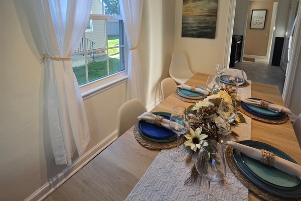 Hardwood charm and a table set to impress—perfect for intimate dinners or lively group gatherings.