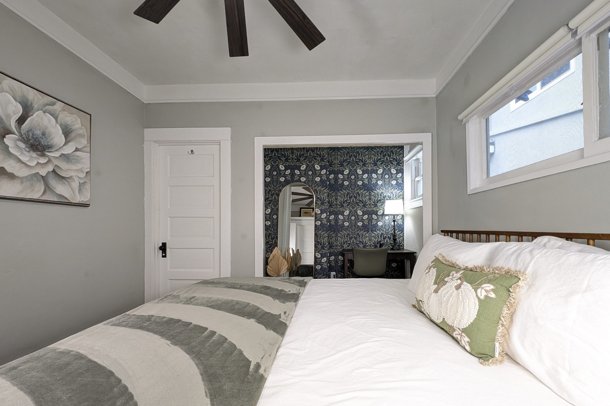 Wake up refreshed in a peaceful bedroom featuring a comfortable bed.