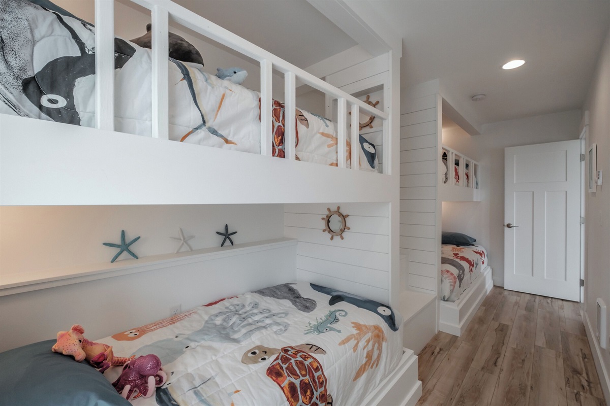 A custom-built bunk room kids will love — perfect for sleepovers, playtime, and coastal adventures! 