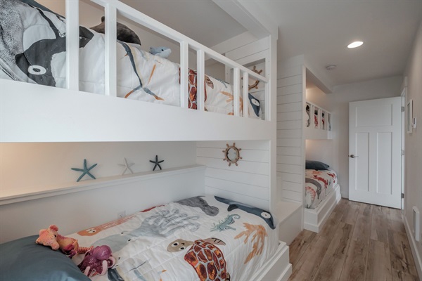 A custom-built bunk room kids will love — perfect for sleepovers, playtime, and coastal adventures! 