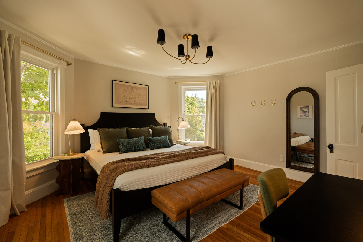 Another spacious king bedroom surrounded by windows and natural light—the perfect place to recharge after exploring Saugerties, the Hudson Valley, or the Catskills.