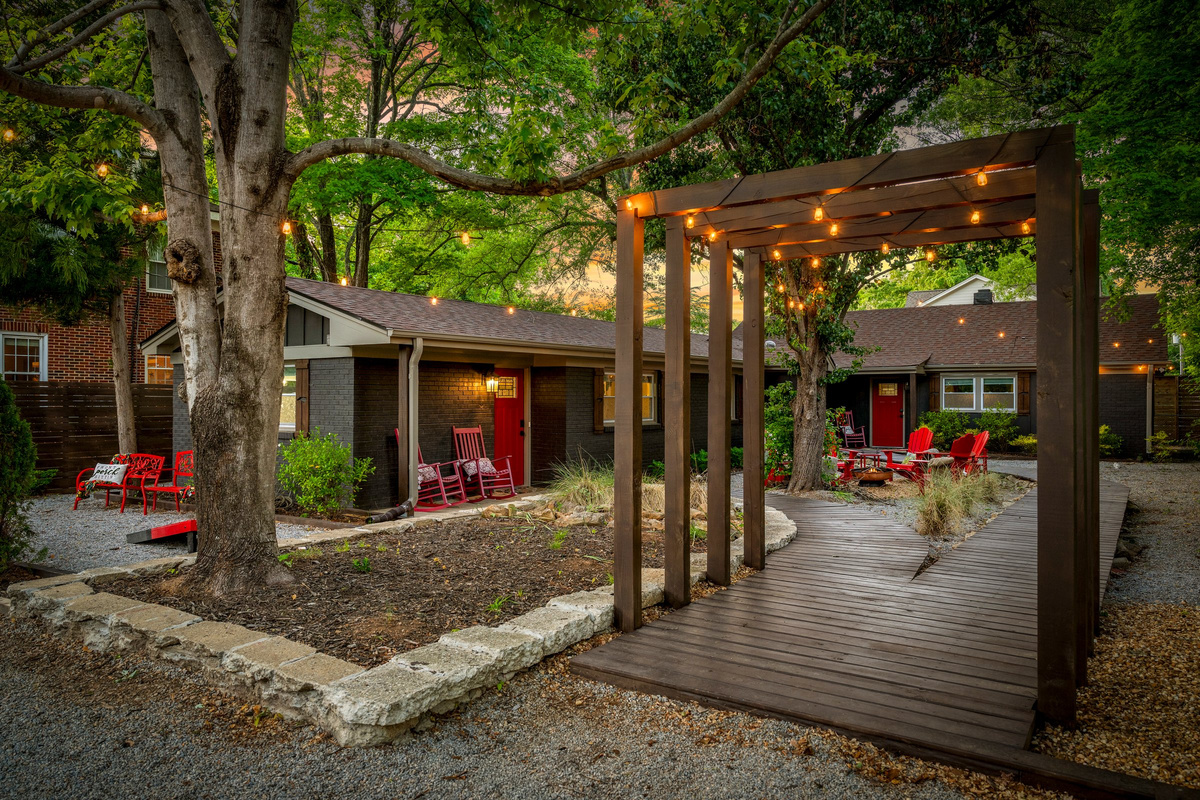 The pergola and boardwalk help create a courtyard that feels more like a retreat than a city property.