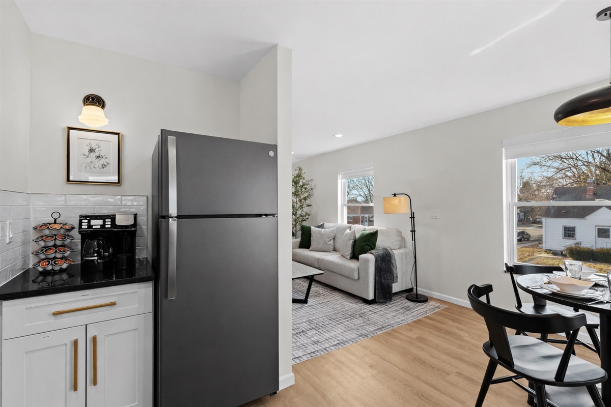 Sunlit open-concept layout blending kitchen, dining, and living areas—modern, airy, and thoughtfully designed for comfort and everyday living.