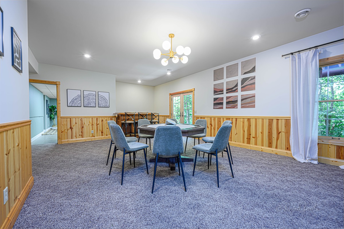 Dry bar with seating for 3 provides another space for gathering