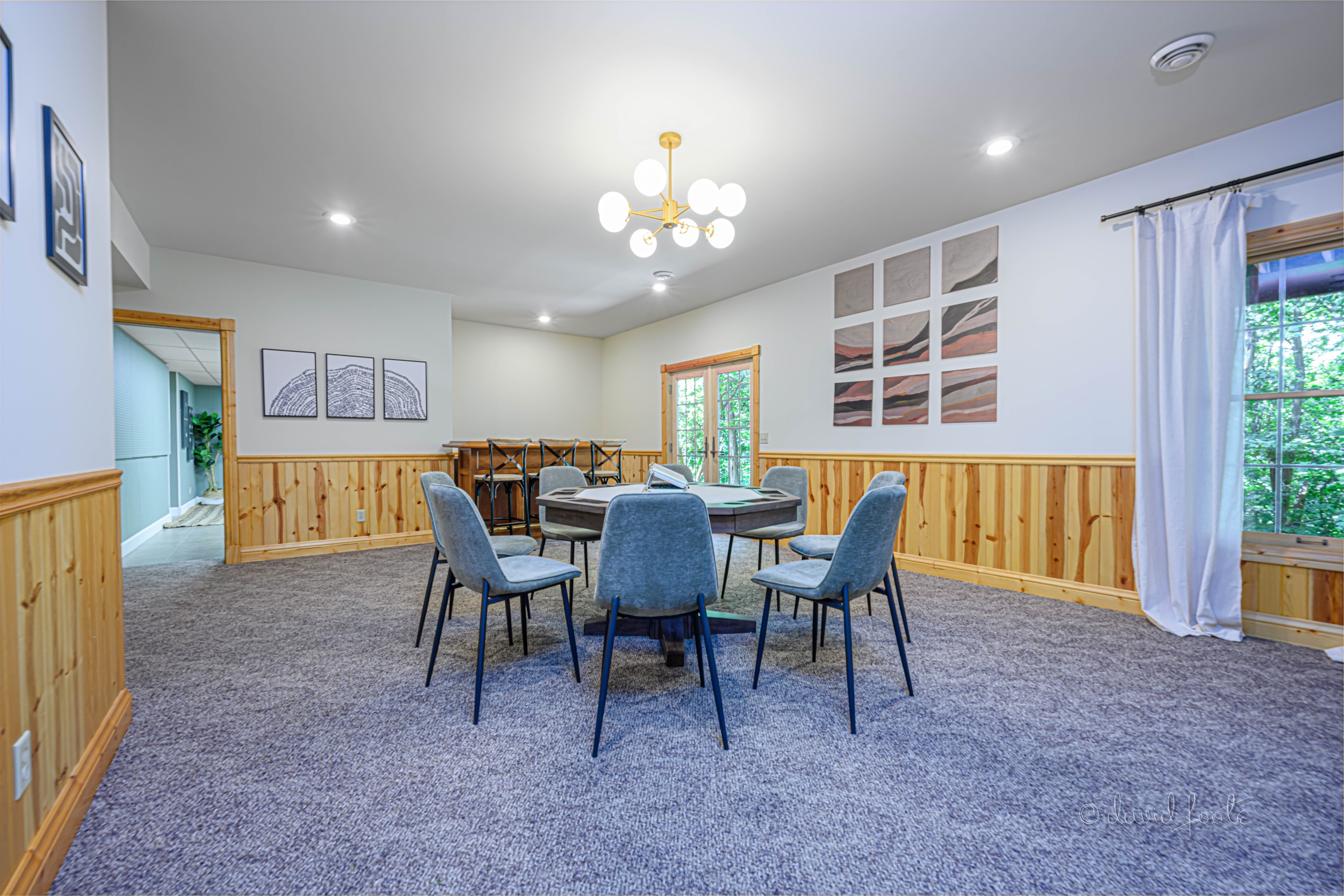 Dry bar with seating for 3 provides another space for gathering