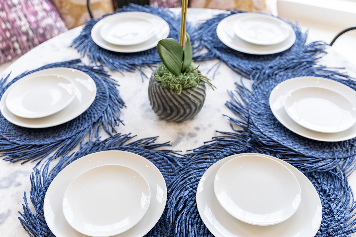 Chinoiserie-inspired place settings add a refined touch to group dinners.