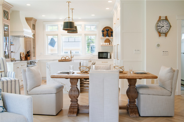 Bright cabinetry, generous workspace, and comfortable seating make this kitchen both stylish and functional.
