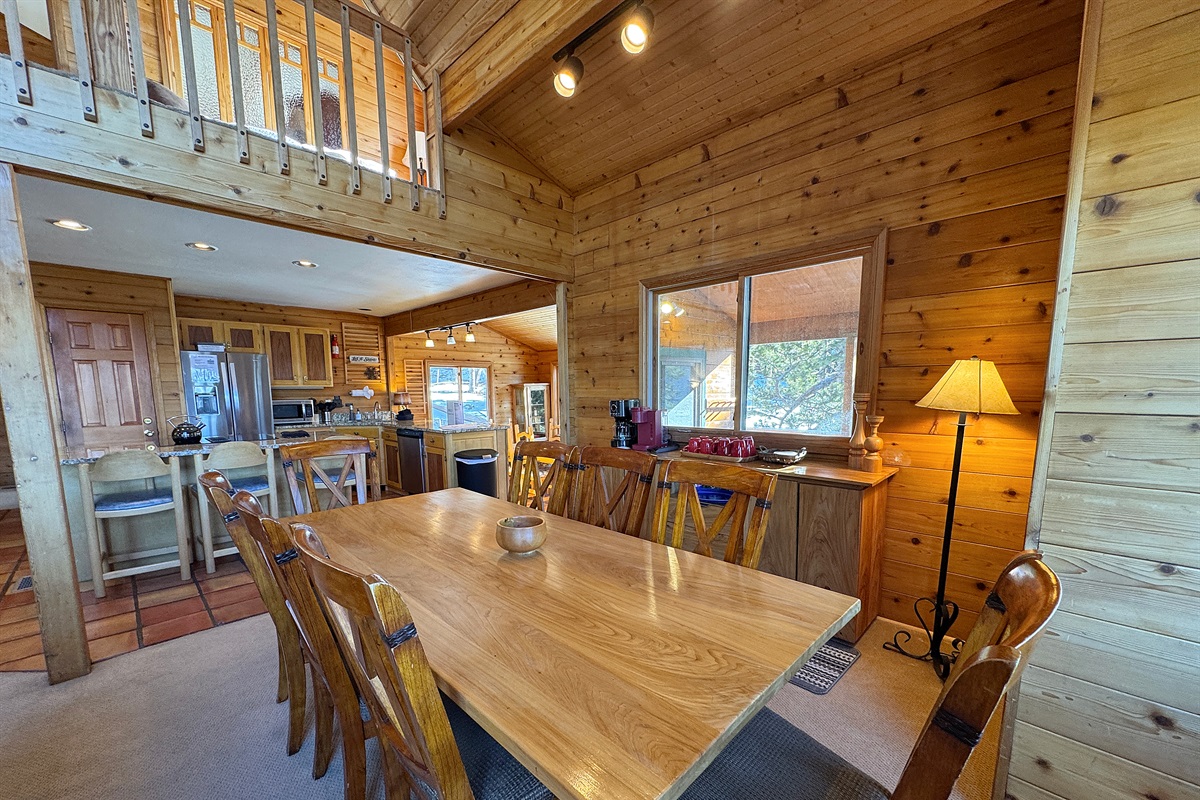 Formal dining and kitchen in background