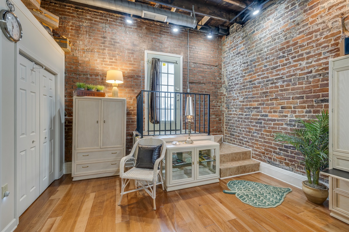 This loft has an exterior leading out to the deck. 