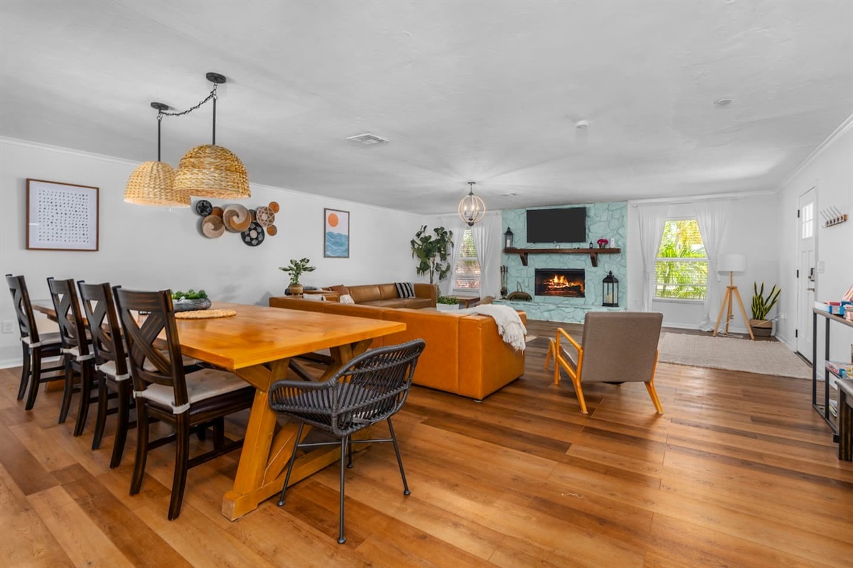 Newly decorated! Huge boho themed living room with 12-foot long custom dining table.